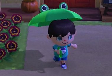 Jeff holds a frog umbrella in Animal Crossing: New Horizons (ACNH) for Nintendo Switch.