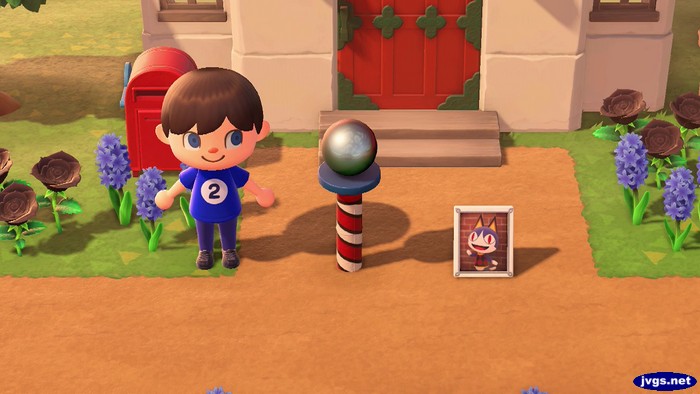 The south pole item and Rover's photo in Animal Crossing: New Horizons.