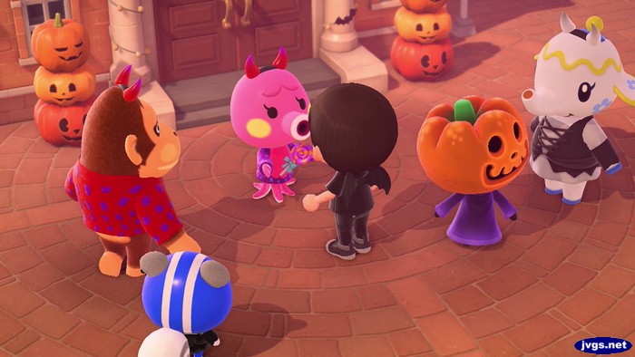 Marina hands me a lollipop. Louie, Agent S, Jack, and Tia also stand nearby.