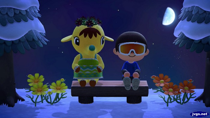 Eloise and Jeff sit on a bench on a cold winter night.