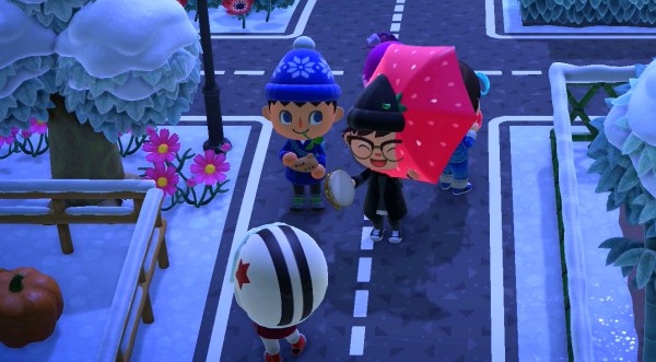 Jeff slices Sam's head with a strawberry umbrella.