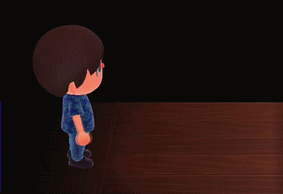 Animated GIF of Peanut running up to be and handing me a song in Animal Crossing: New Horizons.