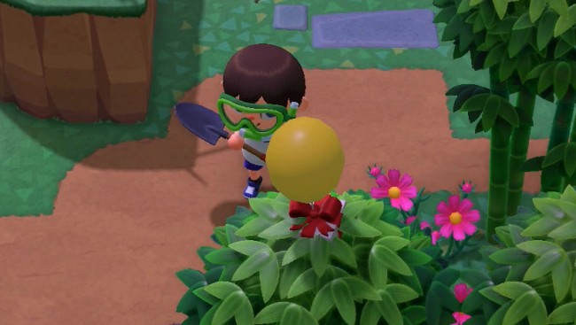 A balloon present flies through bamboo.