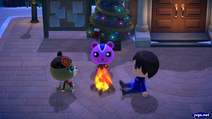 June, Peanut, and Jeff sitting by a fire.