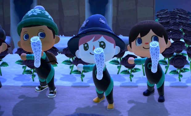 Three of us holding up Venus flower baskets after diving.