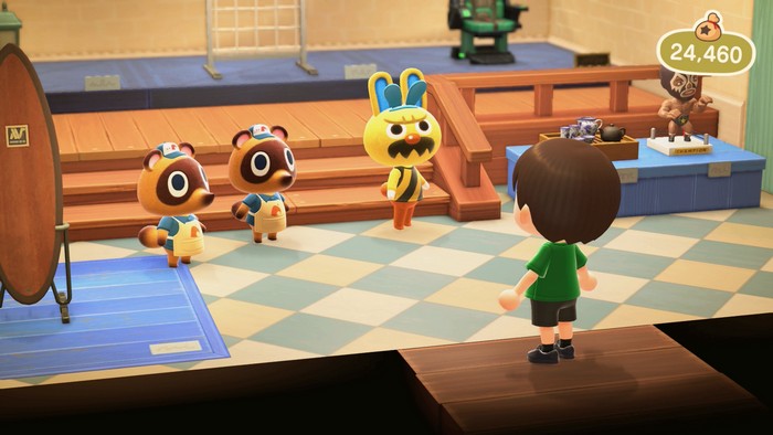 Gaston approaches me in Nook's Cranny, wearing additional bunny ears, in Animal Crossing: New Horizons.