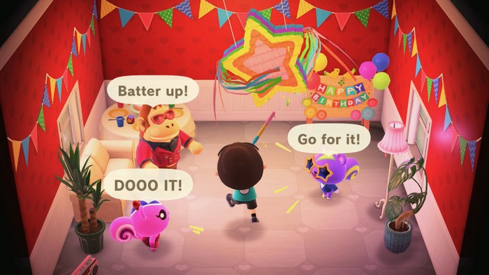Peanut, Louie, and Static encourage me as I hit the pinata at my birthday party.