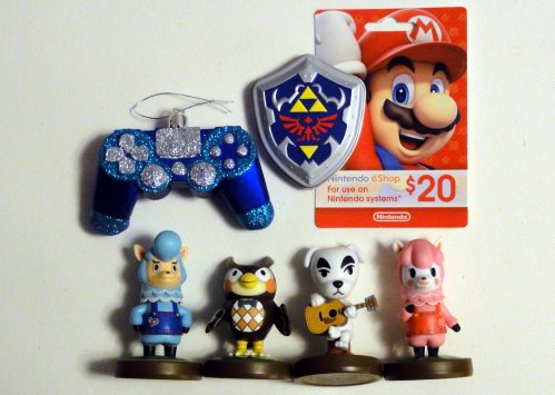 Game controller shaped ornament, tin of Zelda mints, $20 eShop card, Cyrus Amiibo, Blathers Amiibo, K.K. Slider Amiibo, and Reese Amiibo.