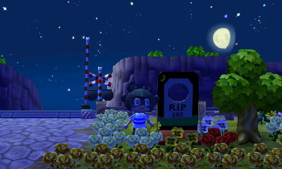 Me standing next to my gravestone standee.