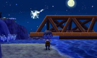 A shooting star and the moon.