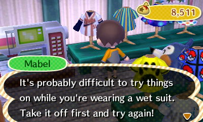 Mabel: It's probably difficult to try things on while you're wearing a wet suit. Take it off!
