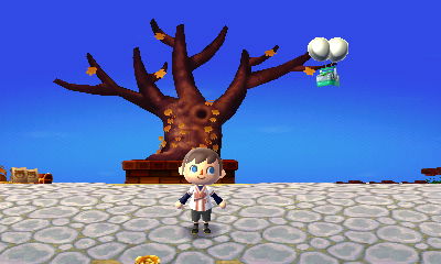 A silver slingshot flying by on a balloon.