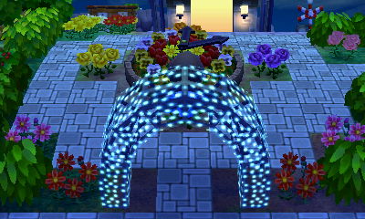 A flower clock and an illuminated arch in the town of Celestia.