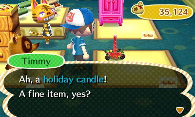 Looking at the holiday candle as Tabby looks on.