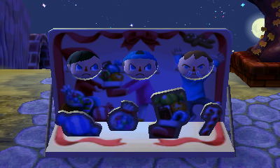 Me, Tom, and Tom using the Naughty or Nice face cutout standee.