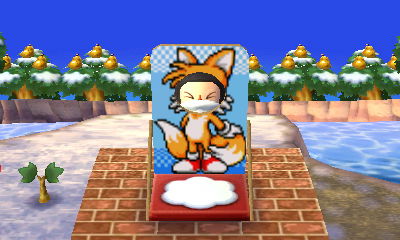 A Tails face-cutout standee.