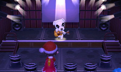 Santa Jeff taking in a musical performance from K.K.