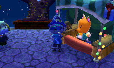 Me wearing a blue New Year's hat.