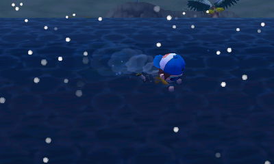 Swimming in the dark ocean as it snows.