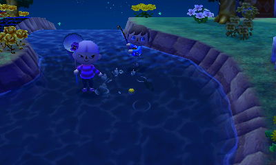 Fishing in the river while standing in the river.