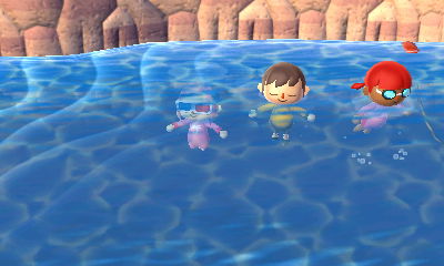 The three of us diving in the ocean.
