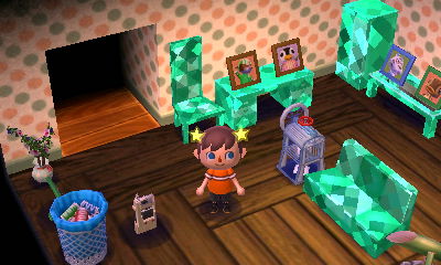 A pastel-dot wall and an old board floor.