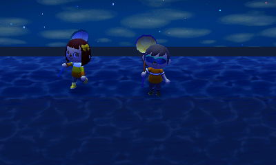 Madisyn and Jeff standing in the ocean.