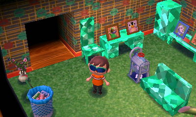 A kitschy wall and backyard lawn.