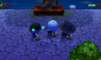 Us sprinkling water from our water cans.