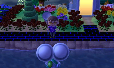 A silver slingshot flying by on two large silver balloons.