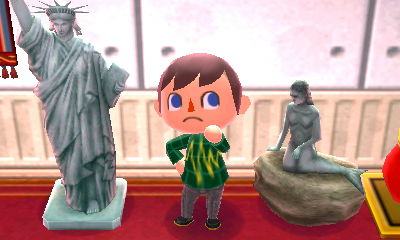 My mermaid statue next to the Statue of Liberty.