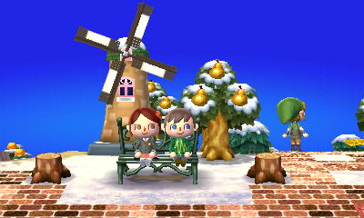 A windmill behind the bench in Tiffiny's town.