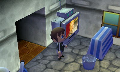 A dresser in front of Agent S's TV.