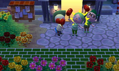 Squishy and Kim holding up toy hammers to the sky.