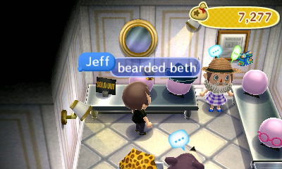Beth tries on a beard accessory.