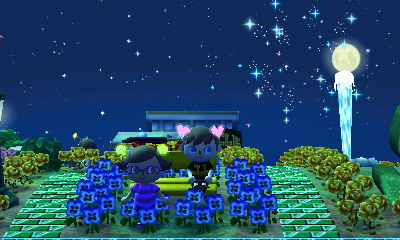 Water from the geyser appears to reach the moon, as fireworks go off in the sky.