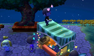 Standing on top of Crazy Redd's stand.