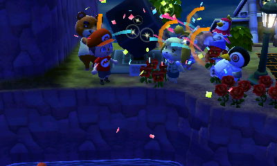 Everyone fires off party poppers at the completion ceremony for the cube sculpture.