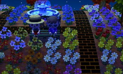 Daisy and Jeff sitting on the metal bench.