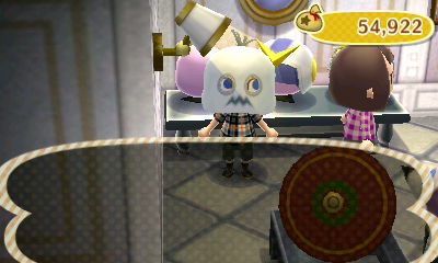 Trying on a ghost mask in Able Sisters.