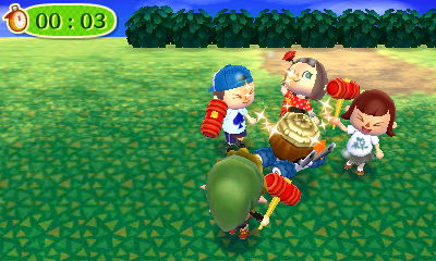 The four of us having fun with toy hammers on an island tour.