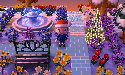 My ice brick path near my fountain, illuminated tree, and metal bench.