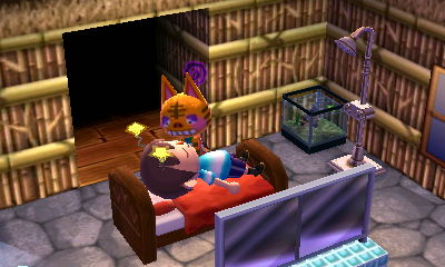 Tabby makes a weird face at me as I lie in her bed.