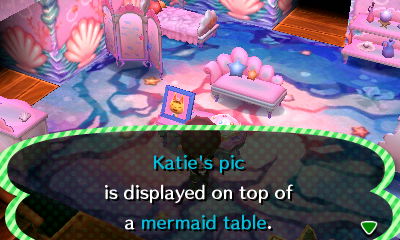 Katie's pic is displayed on top of a mermaid table.
