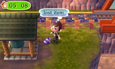 A lost mitten on the ground next to my zen bell.