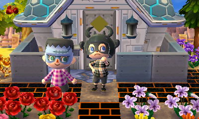 Wendy dressed as a monster and Jeff dressed as a bug.