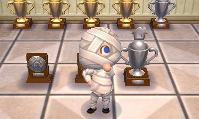 The silver HHA trophy from the Happy Homes Academy.