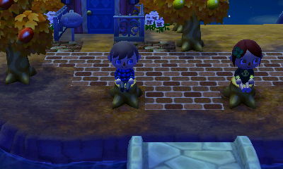 Me and Tiffiny sitting on tree stumps.