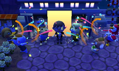 Everybody fires off party poppers at the completion ceremony for the train station reconstruction.