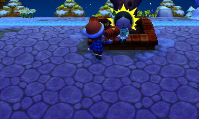 I hit Meli with a toy hammer as she sits at the town tree and views the town history.